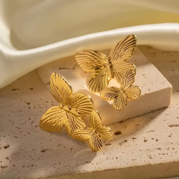 Aretes mariposa pegados - Imagen 2